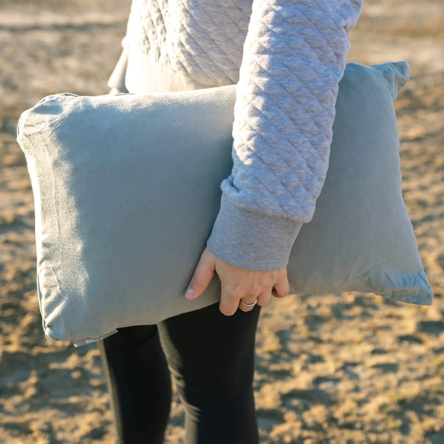 Klymit Drift Summit camp pillow supporting a sleeper outdoors