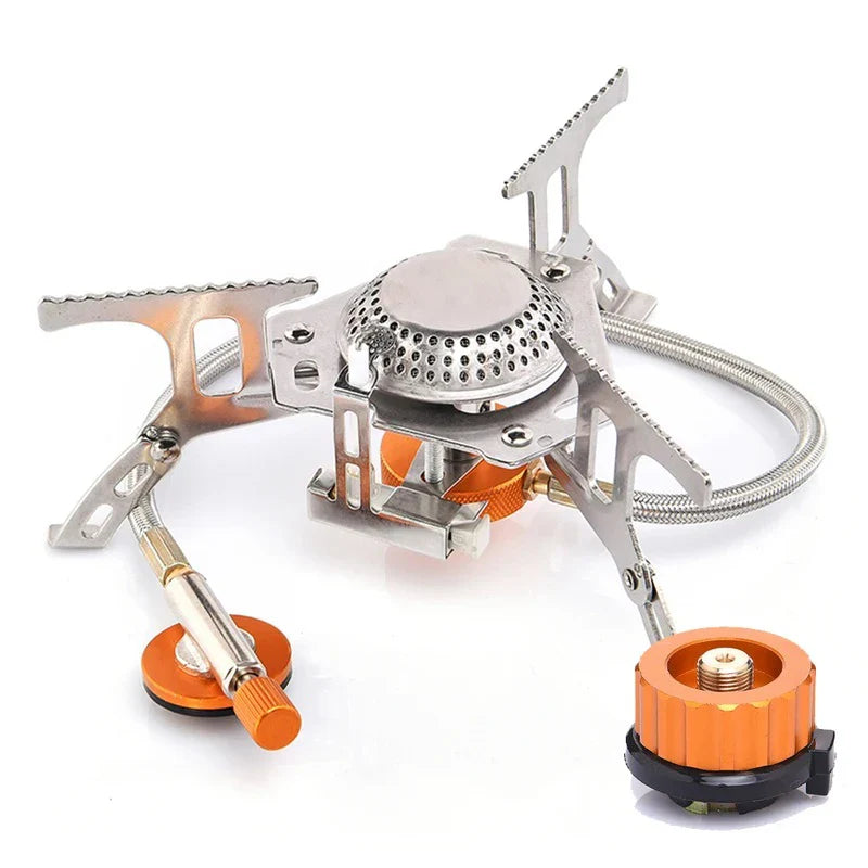 Trailblaze Portable Camp Stove folded open on a white background showing its stand and orange fuel adapter