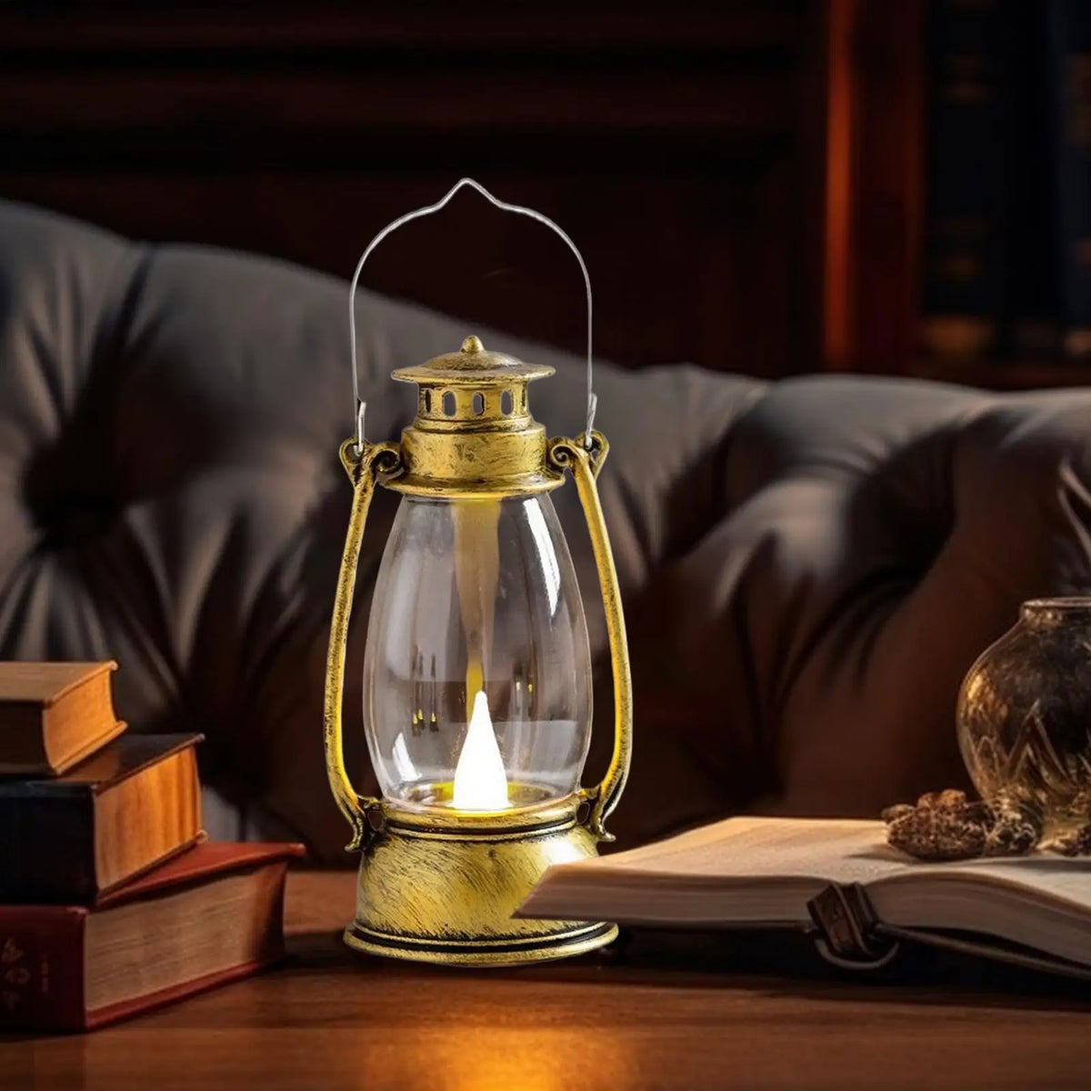 Ember Glow Lantern in bronze, lit on a wooden tabletop at night