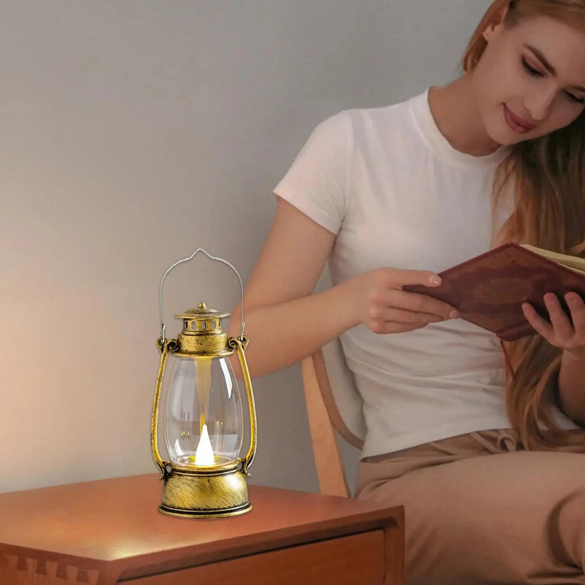 Hand adjusting the flame-effect switch on the Ember Glow Lantern