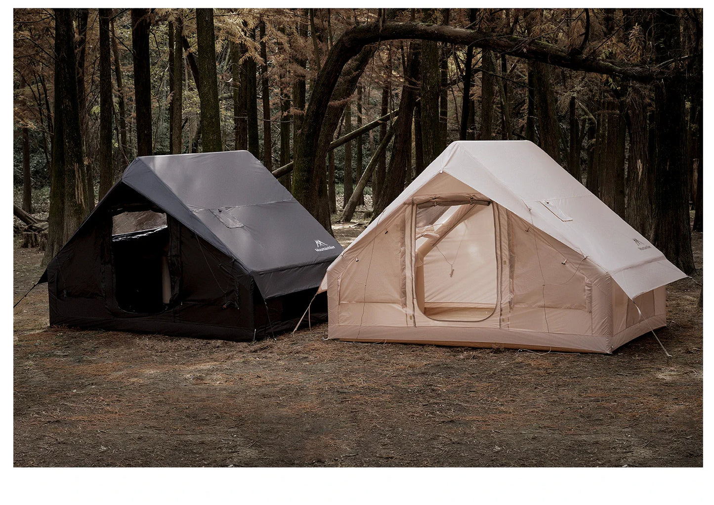 Starry Sky Basecamp Tent in black, pitched at a nighttime forest campsite