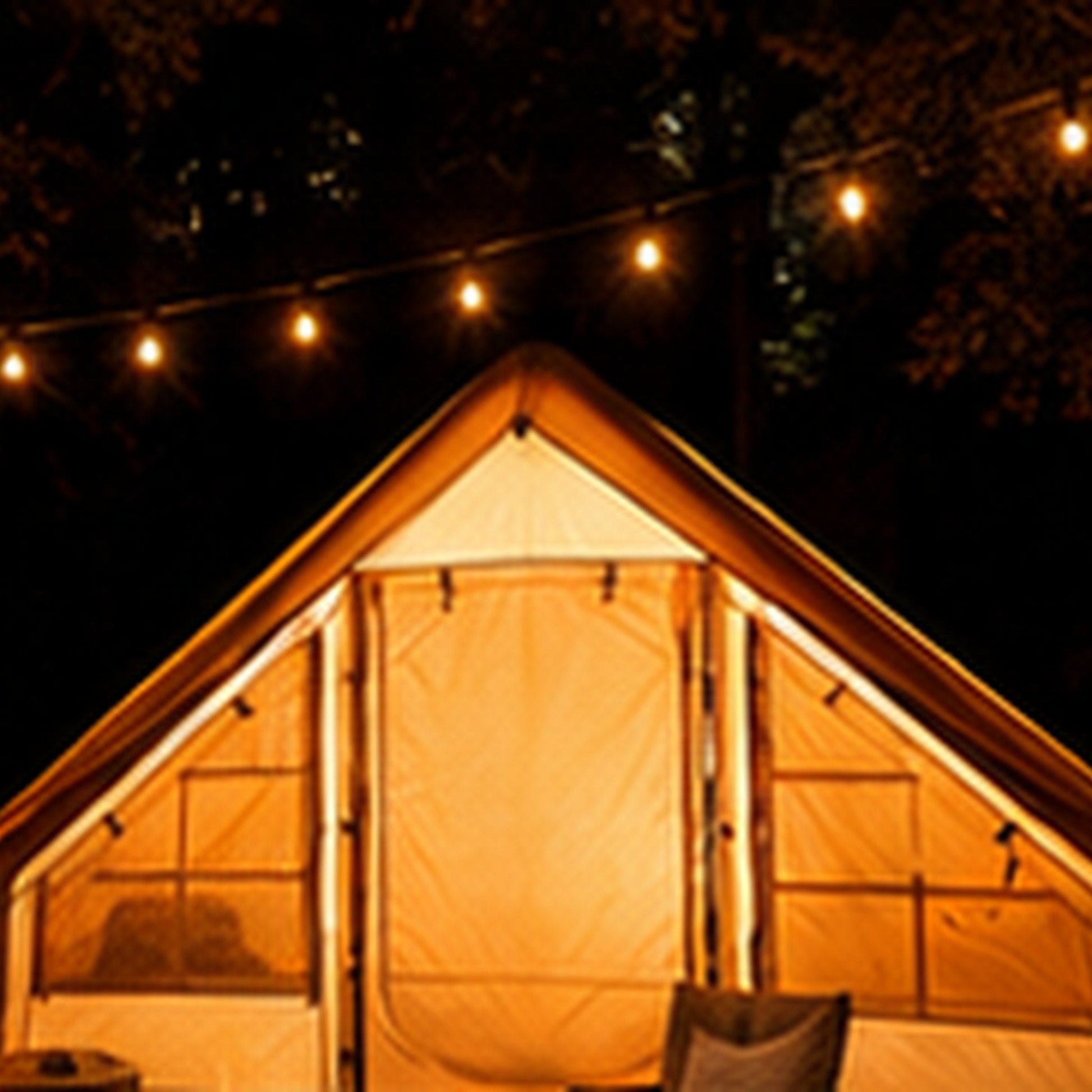Starry Sky Basecamp Tent at night with string lights